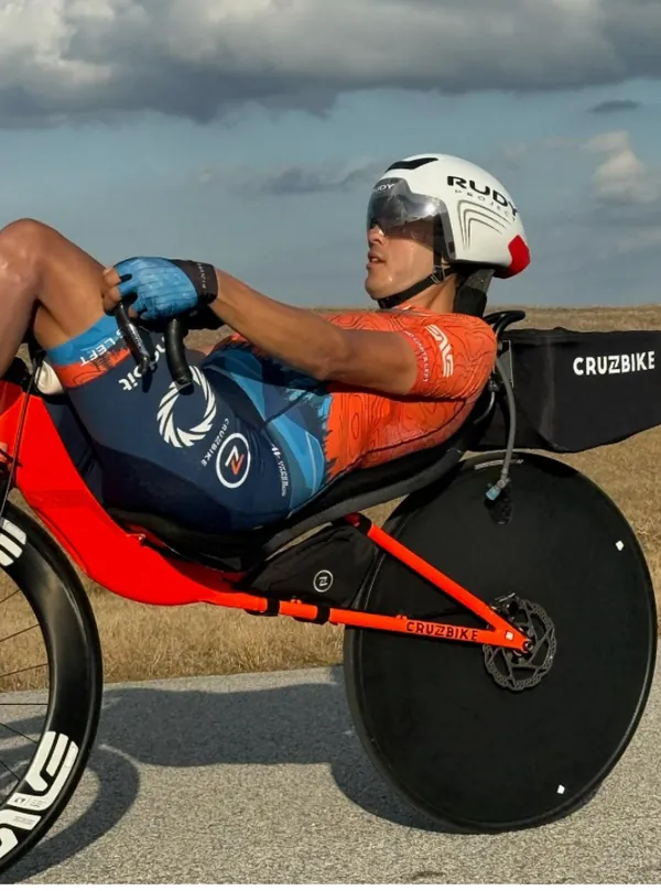 Matthew Lefthand racing his Cruzbike with a disc wheel